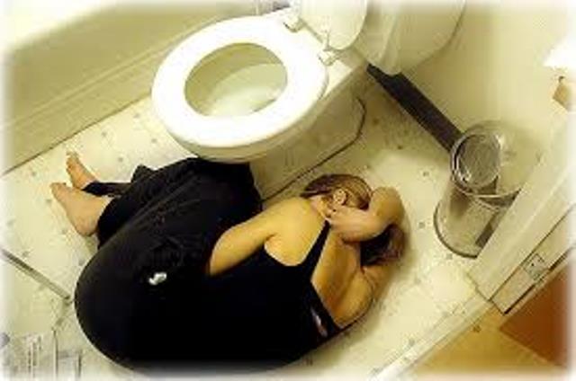 women laying down in bathroom