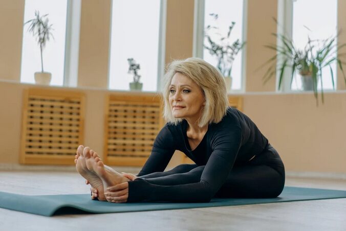 old woman doing yoga